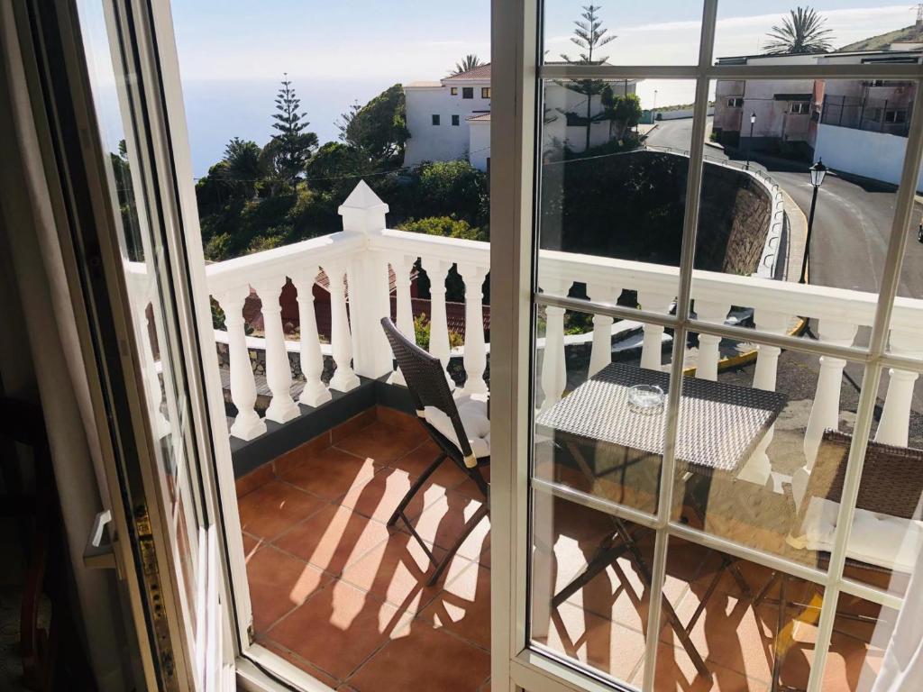a balcony with a view of a white fence at Hotel Boomerang in Valverde