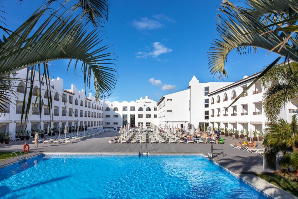 a view of the hotel from the pool at Mac Puerto Marina Benalmádena in Benalmádena