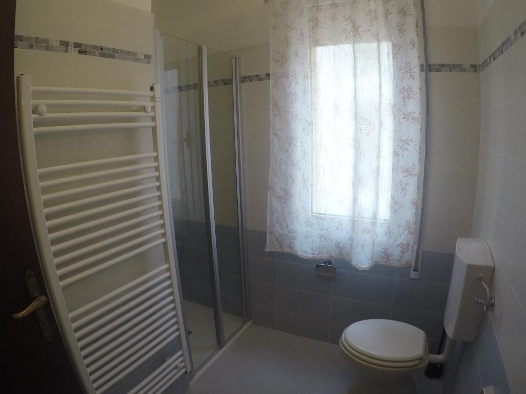 Koupelna v ubytování Residence Caorle Apartments - Agenzia Cocal