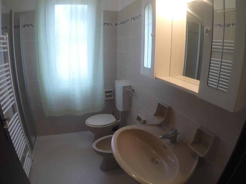 Koupelna v ubytování Residence Caorle Apartments - Agenzia Cocal