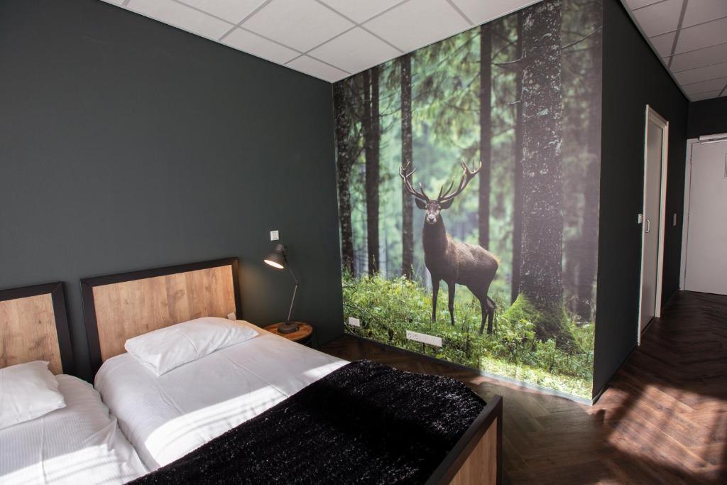 Postel nebo postele na pokoji v ubytování Hotel Spelderholt