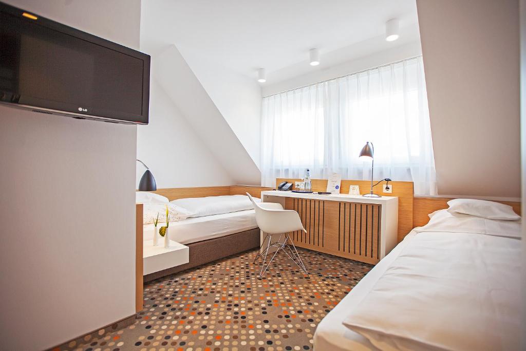 Postel nebo postele na pokoji v ubytování Hotel Waldhorn