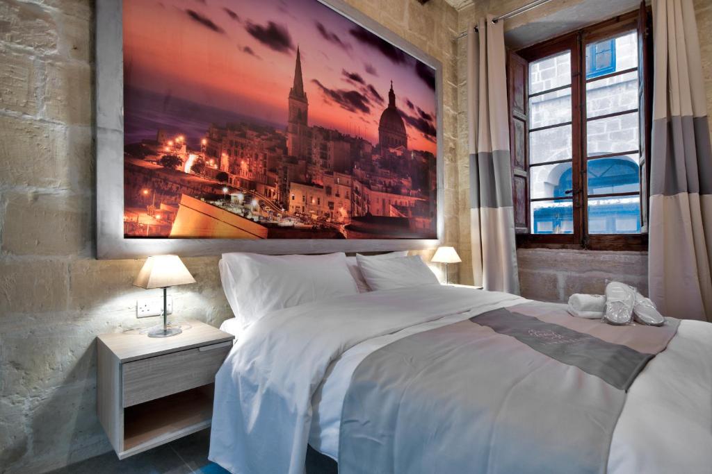 Postel nebo postele na pokoji v ubytování Laparelli Suites: Luxury Suite 2