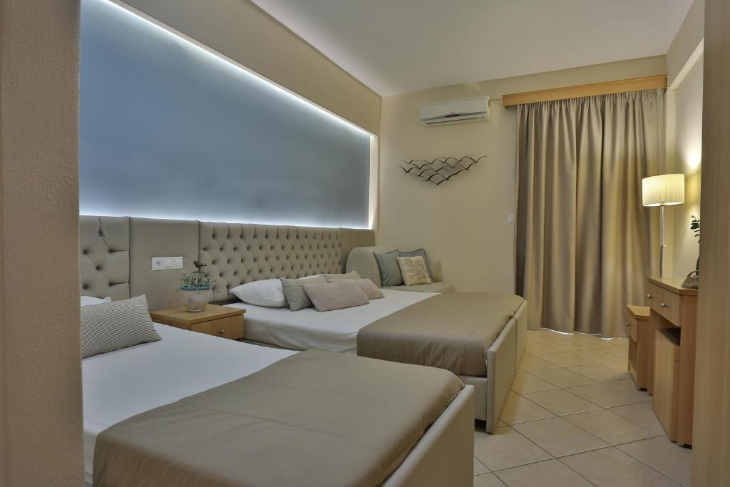 Postel nebo postele na pokoji v ubytování Irida Apartments