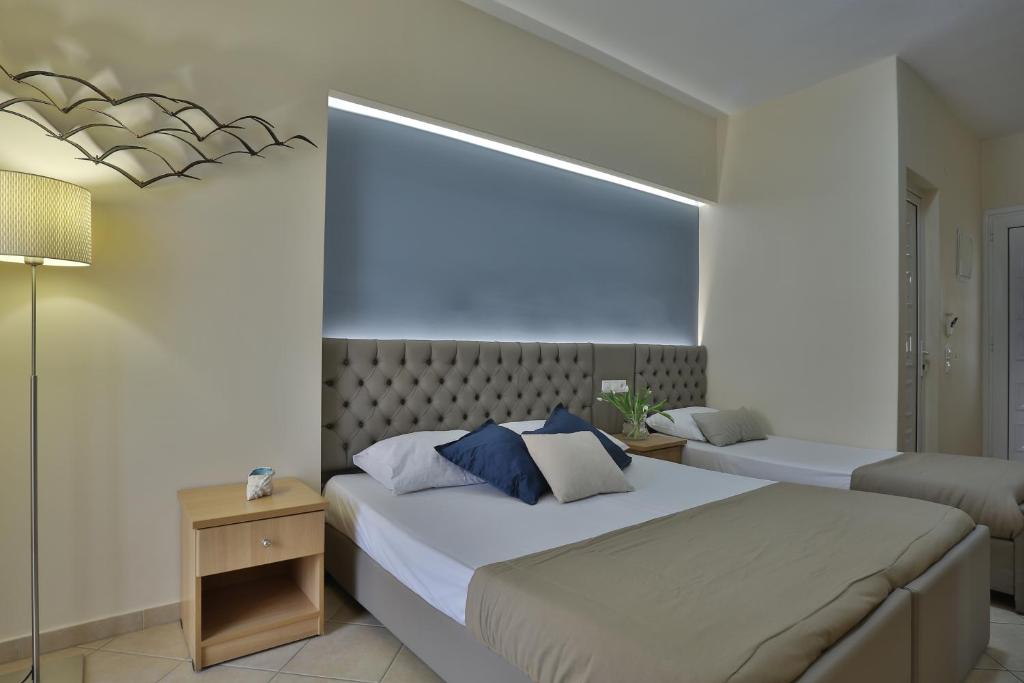 Postel nebo postele na pokoji v ubytování Irida Apartments