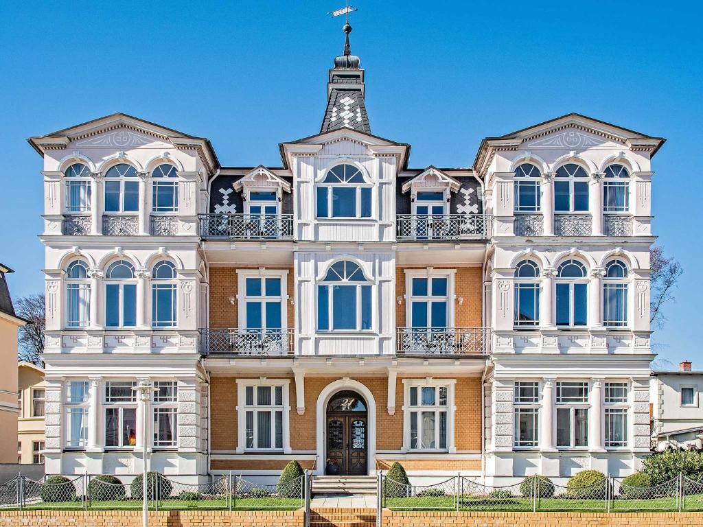 a large building with a tower on top of it at Villa Sommerfreude in Bansin