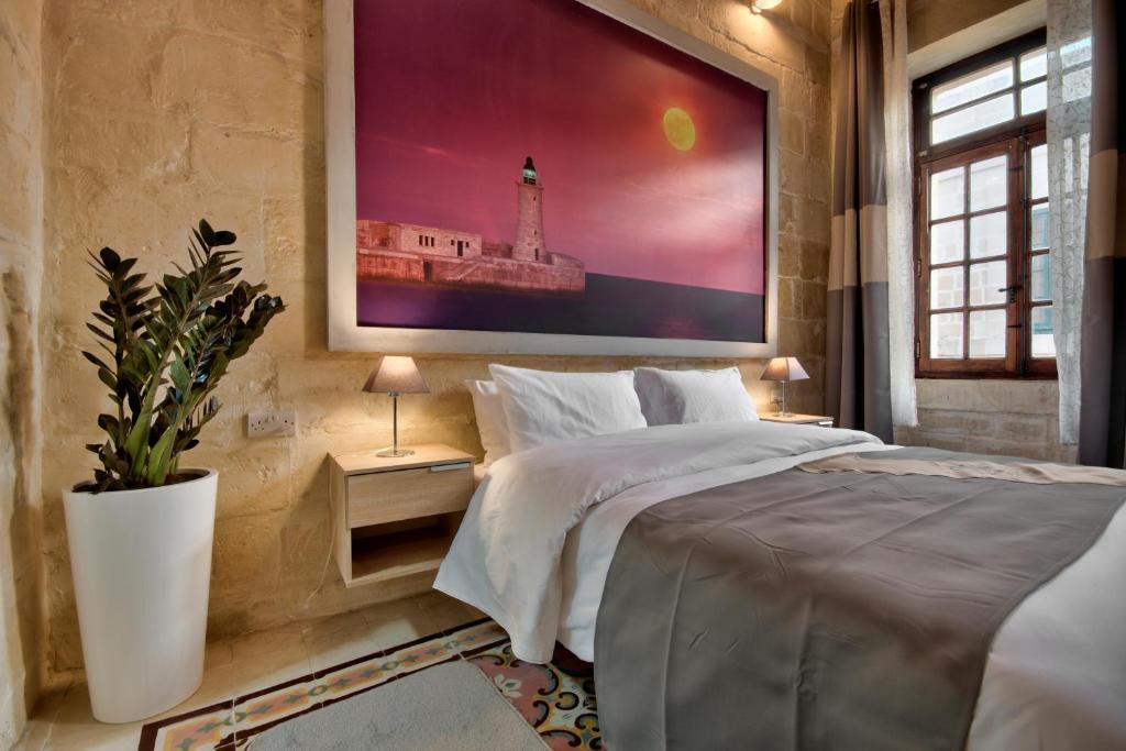 Postel nebo postele na pokoji v ubytování Laparelli Suites: Luxury Suite 3