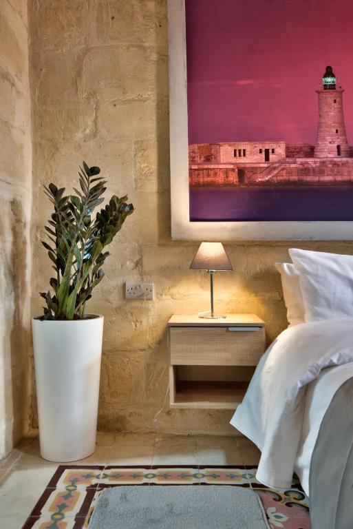 Postel nebo postele na pokoji v ubytování Laparelli Suites: Luxury Suite 3