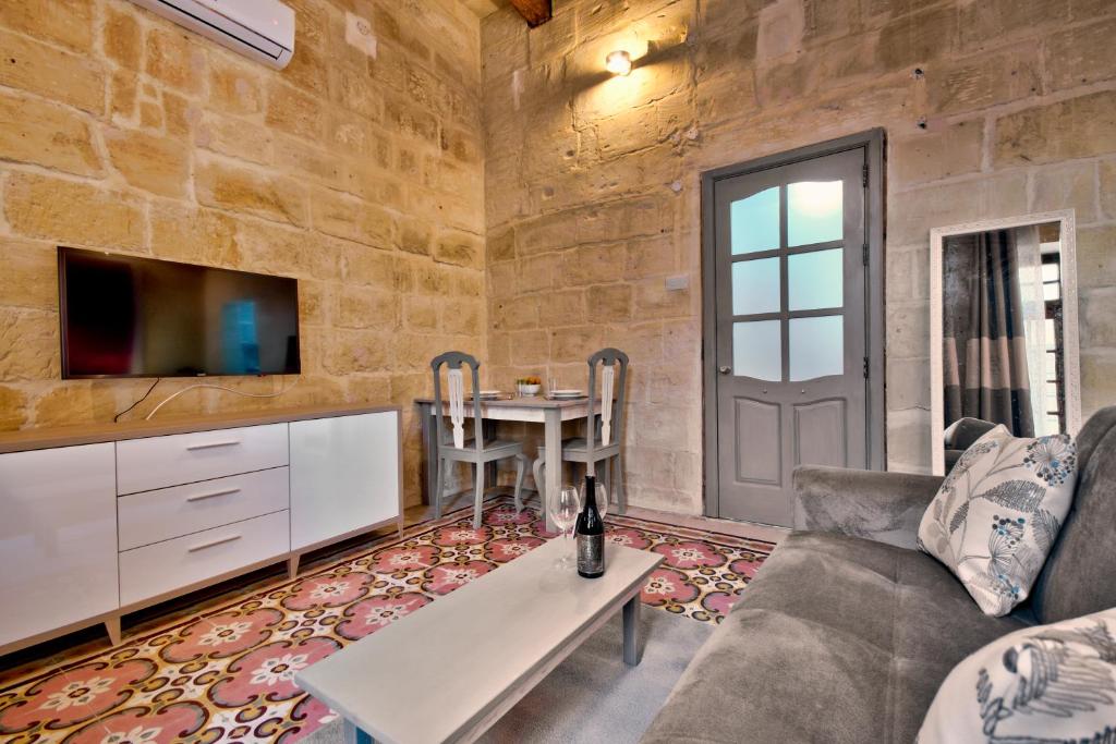 TV a/nebo společenská místnost v ubytování Laparelli Suites: Luxury Suite 3