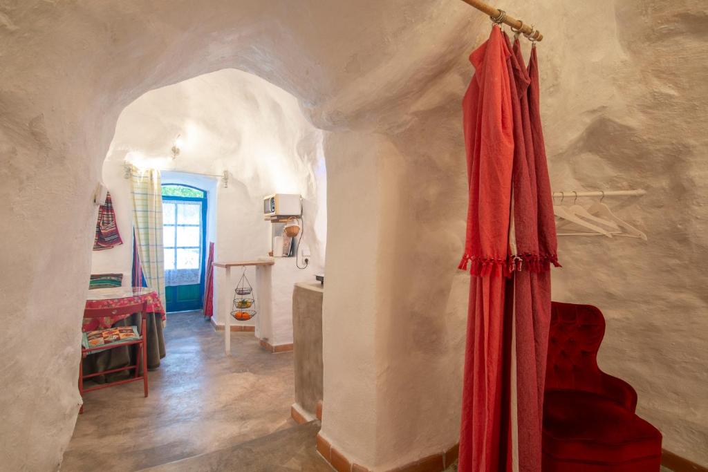 Postel nebo postele na pokoji v ubytování Casa Cueva Muntasal