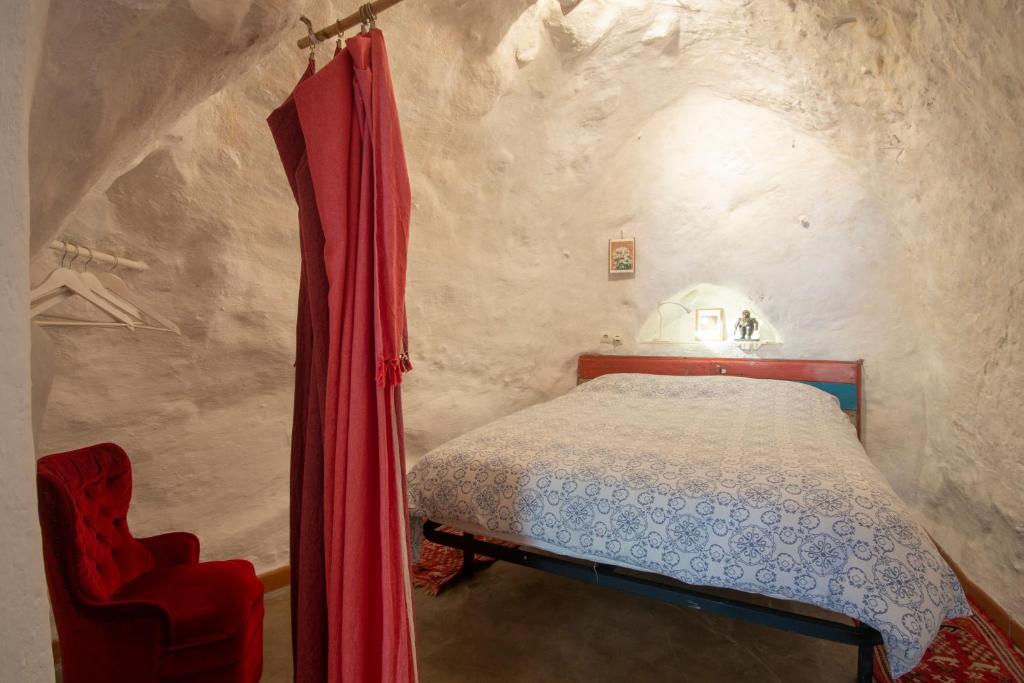 Postel nebo postele na pokoji v ubytování Casa Cueva Muntasal