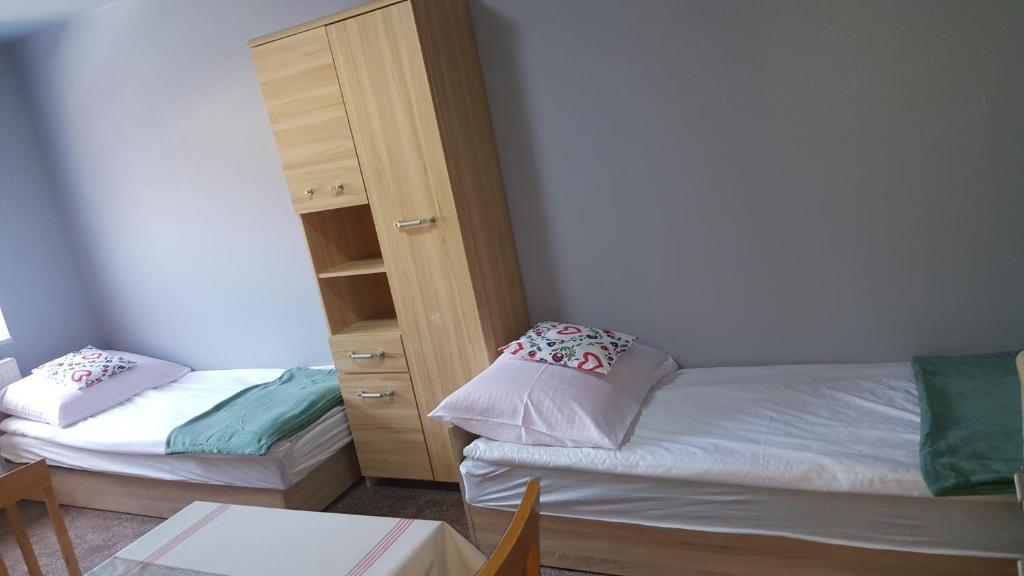 Posteľ alebo postele v izbe v ubytovaní Pokoje Gościnne Nad Złotym Potokiem