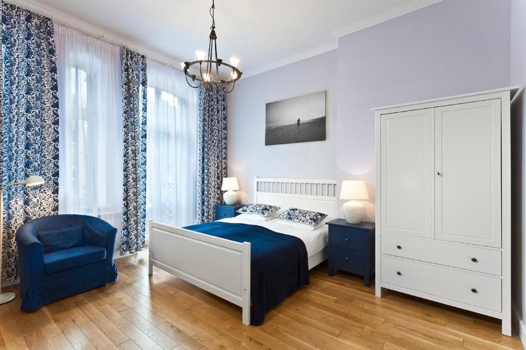 Posteľ alebo postele v izbe v ubytovaní Apartamenty Pomarańczarnia