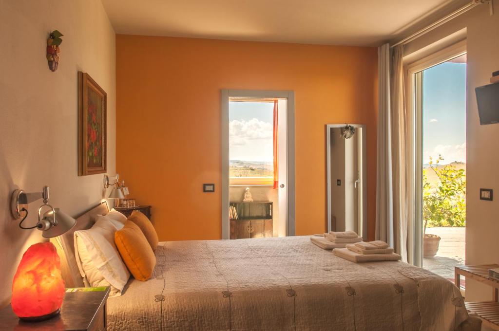 Postel nebo postele na pokoji v ubytování Casa LuceSole