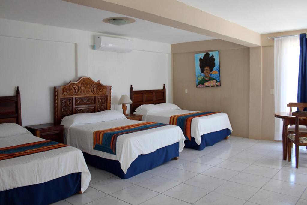 Postel nebo postele na pokoji v ubytování Hotel Mayto