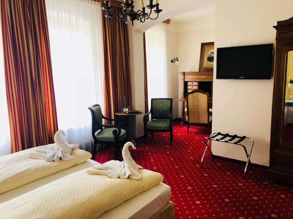 Postel nebo postele na pokoji v ubytování Hotel Alt Görlitz