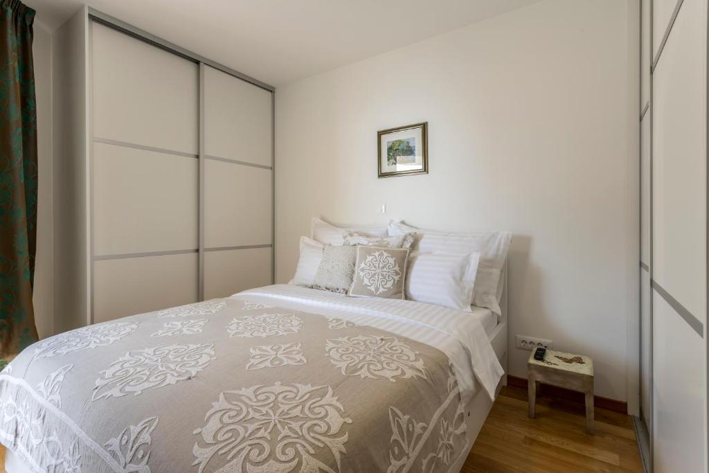 Postel nebo postele na pokoji v ubytování Adriatic Queen Rooms & Apartments