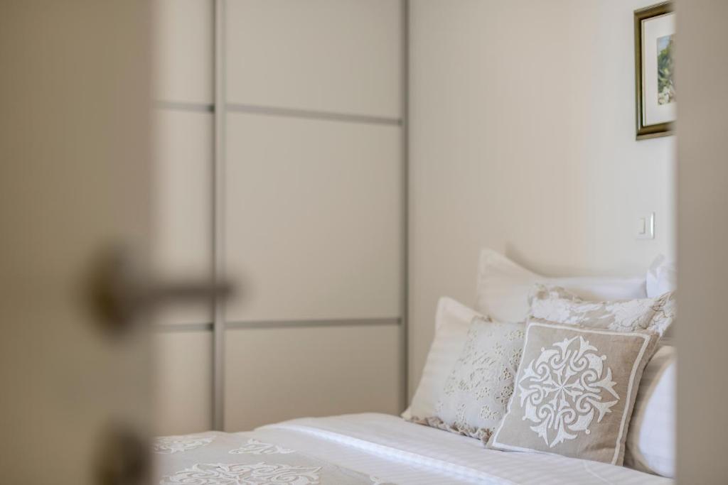 Postel nebo postele na pokoji v ubytování Adriatic Queen Rooms & Apartments