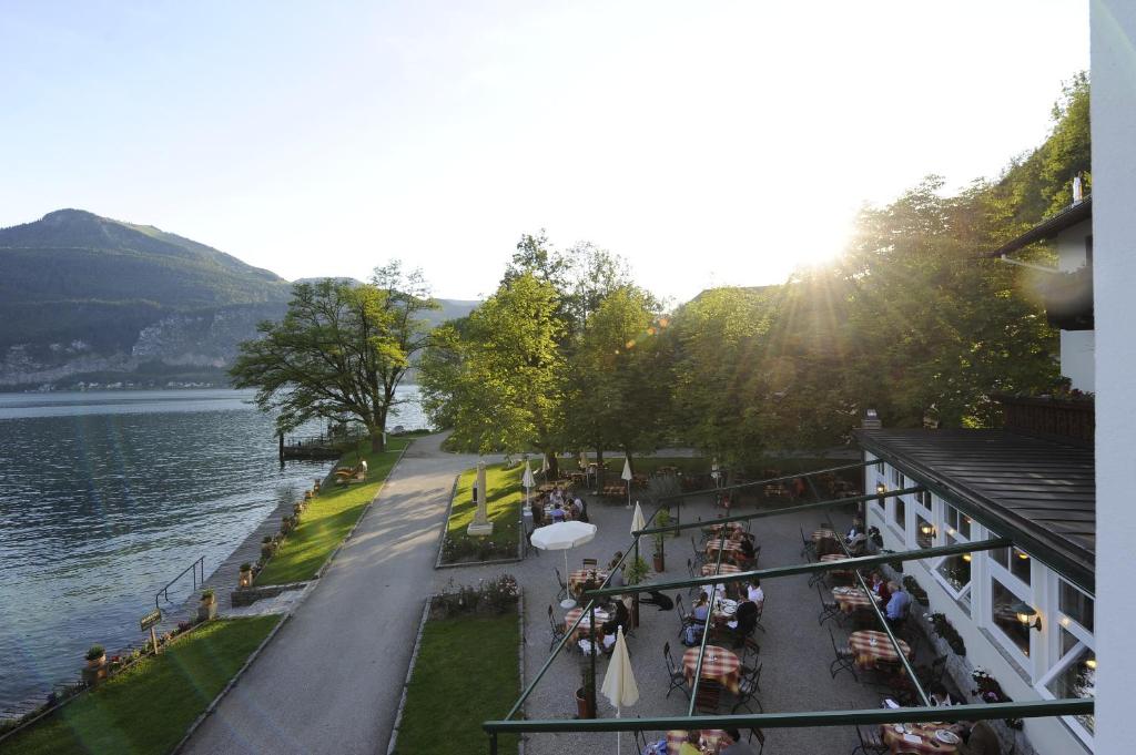 a view of a street next to a body of water at Hotel & Gasthof Fürberg in Sankt Gilgen
