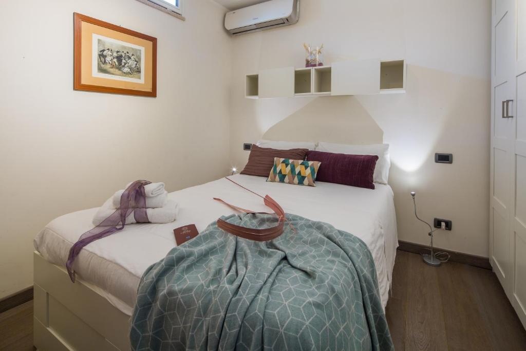 Postel nebo postele na pokoji v ubytování Hotel Castel Gandolfo