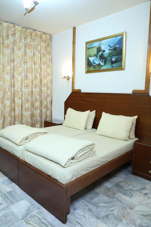 Postel nebo postele na pokoji v ubytování Viccini Suites