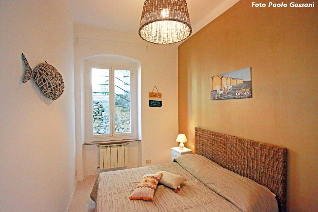 Łóżko lub łóżka w pokoju w obiekcie Cav Gli Ulivi di Bogliasco parcheggio privato gratuito