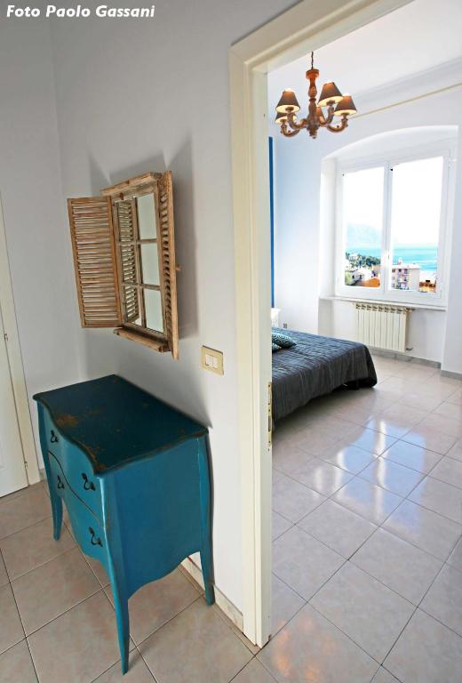 Łóżko lub łóżka w pokoju w obiekcie Cav Gli Ulivi di Bogliasco parcheggio privato gratuito