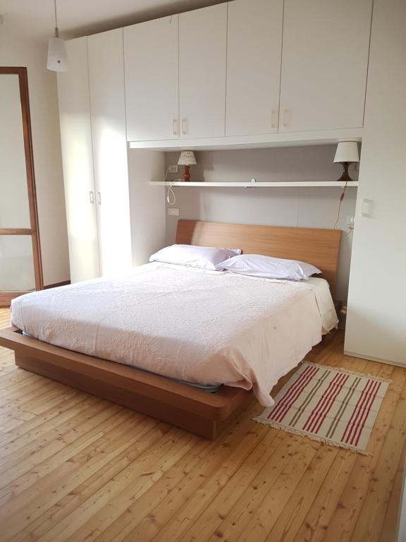 Postel nebo postele na pokoji v ubytování Alloggio il Giglio