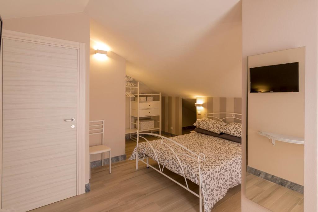 Postel nebo postele na pokoji v ubytování Merlo d'Oro