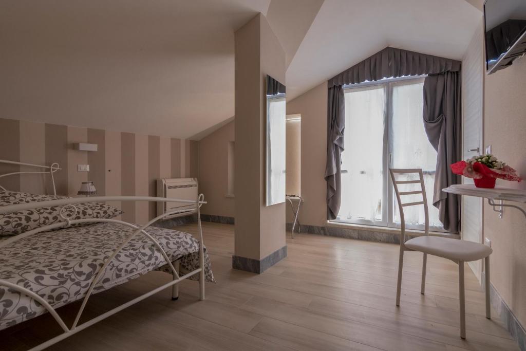 Postel nebo postele na pokoji v ubytování Merlo d'Oro