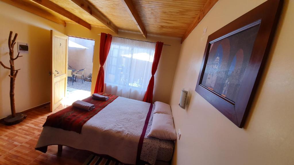 Postel nebo postele na pokoji v ubytování Hostal Ckamai