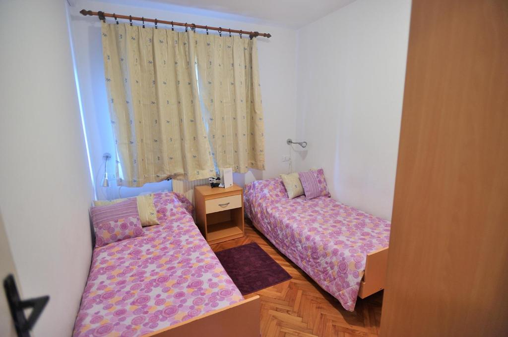 Posteľ alebo postele v izbe v ubytovaní Apartments Fabac