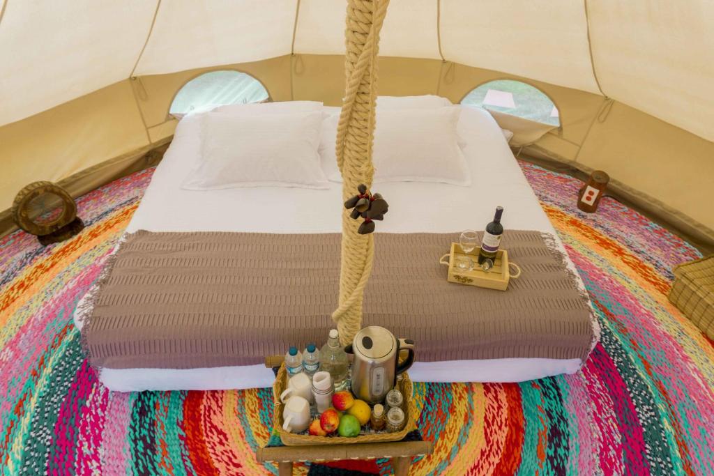 Postel nebo postele na pokoji v ubytování Glamping Finca Corazón