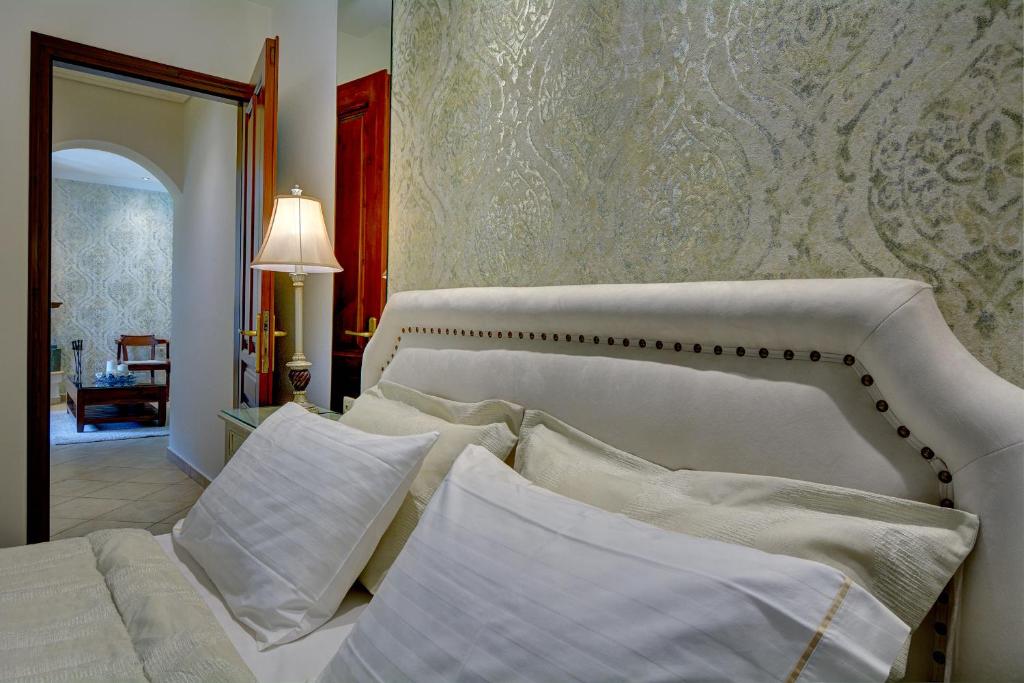 Postel nebo postele na pokoji v ubytování Iatrou Guesthouse