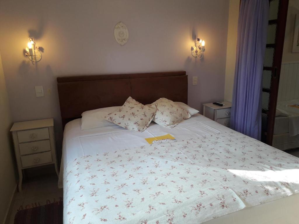 Cama ou camas em um quarto em Recanto da Praia
