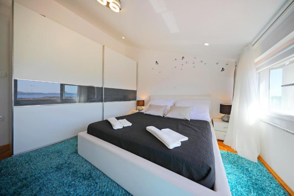 Posteľ alebo postele v izbe v ubytovaní Magic Blue Sky Apartment