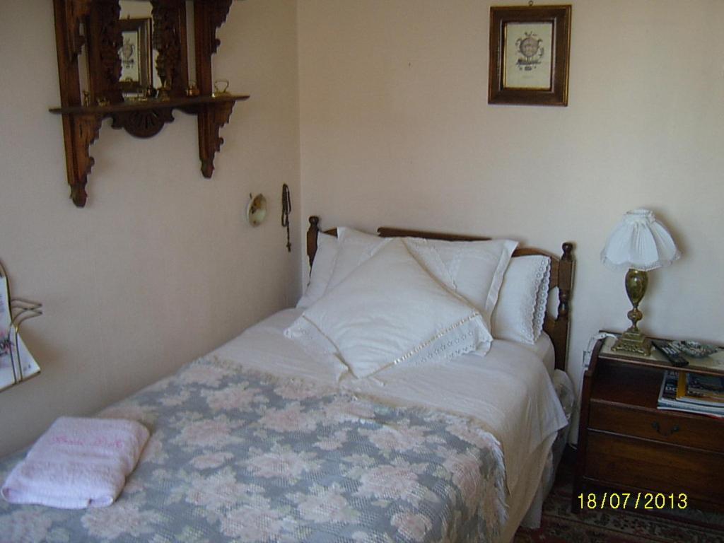 Ένα ή περισσότερα κρεβάτια σε δωμάτιο στο Hostal Don Mariano