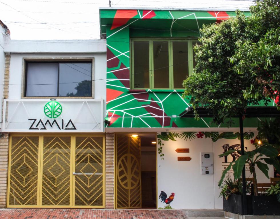 a building with a zawi sign on it at Zamia Hostel in Bucaramanga