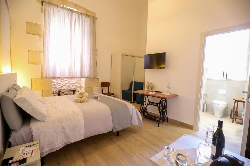 Postel nebo postele na pokoji v ubytování La Sicilia in un sogno