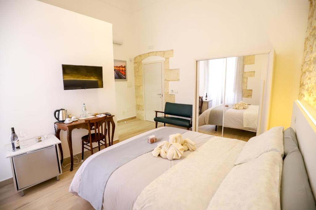 Postel nebo postele na pokoji v ubytování La Sicilia in un sogno