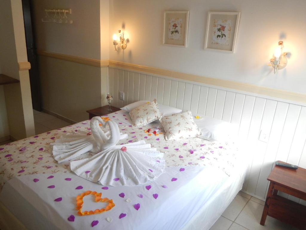 Cama ou camas em um quarto em Recanto da Praia