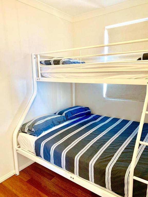 Postel nebo postele na pokoji v ubytování Sunset Beach Holiday Park