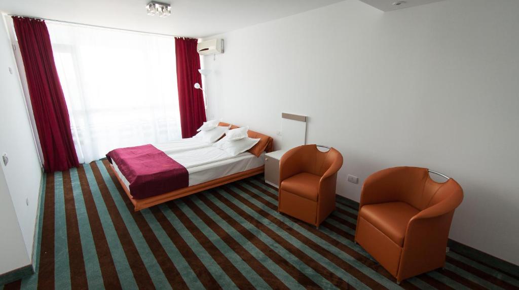 Postel nebo postele na pokoji v ubytování Hotel Opal