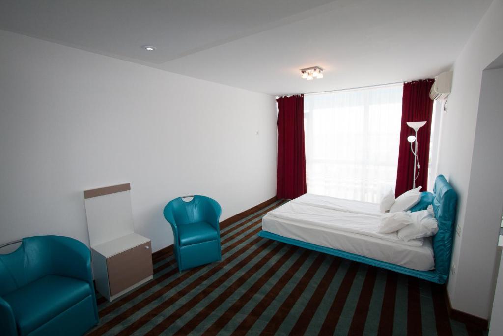 Postel nebo postele na pokoji v ubytování Hotel Opal