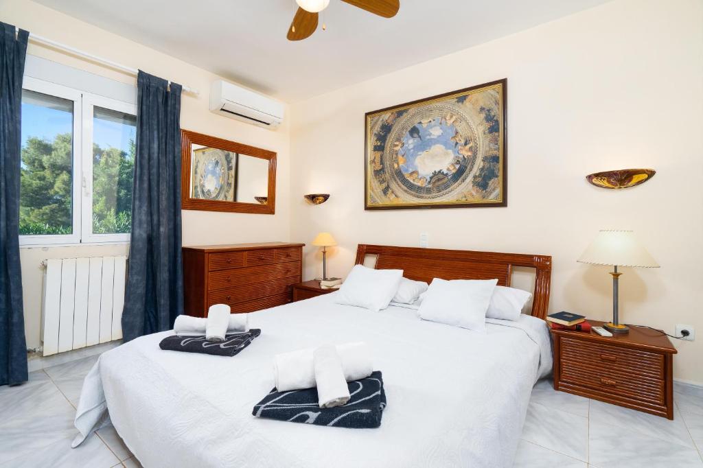 Säng eller sängar i ett rum på Villa Hermosa
