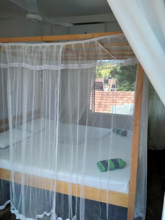 Postel nebo postele na pokoji v ubytování Mallika Resort