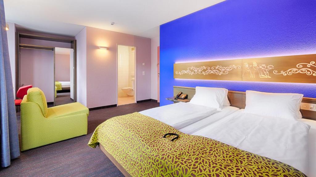 Postel nebo postele na pokoji v ubytování Hotel Drei Könige Luzern