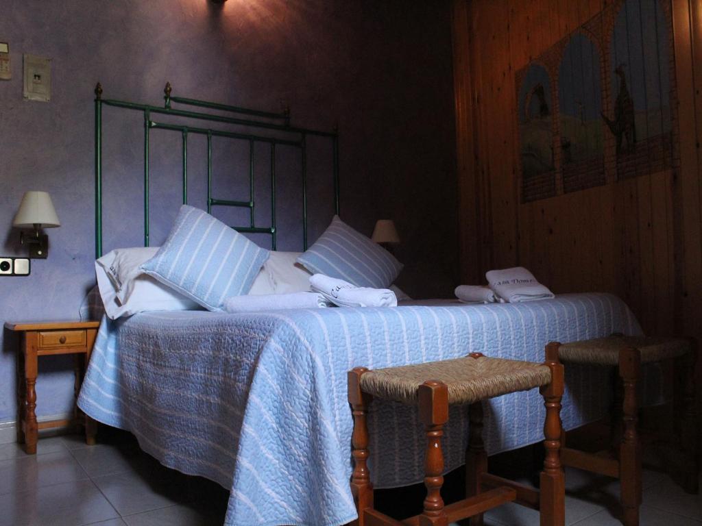 Postel nebo postele na pokoji v ubytování Hotel Casa Domenc