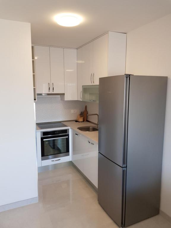 Kuchyň nebo kuchyňský kout v ubytování Apartmani MARELLA
