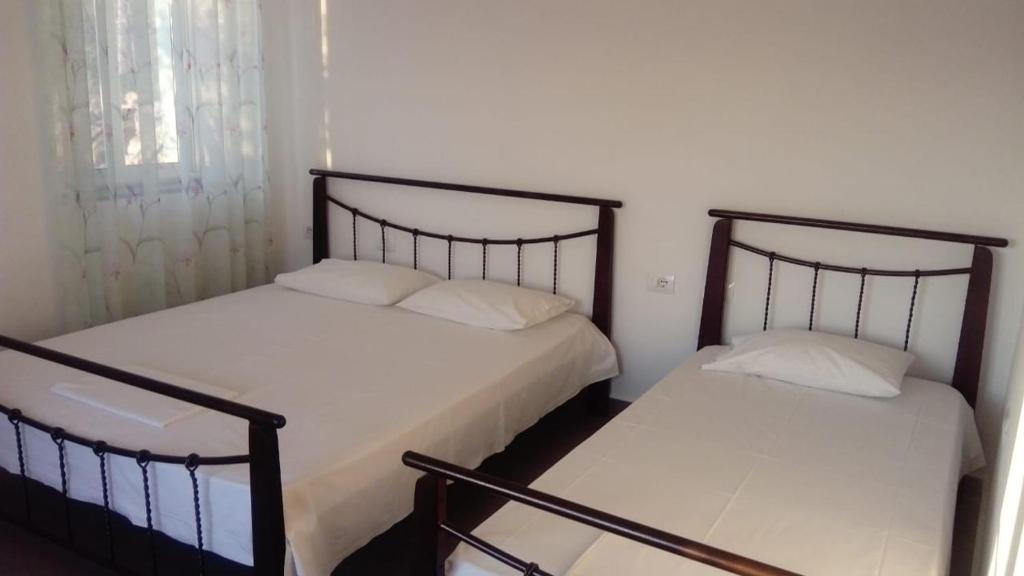 Postel nebo postele na pokoji v ubytování Valentina Rooms